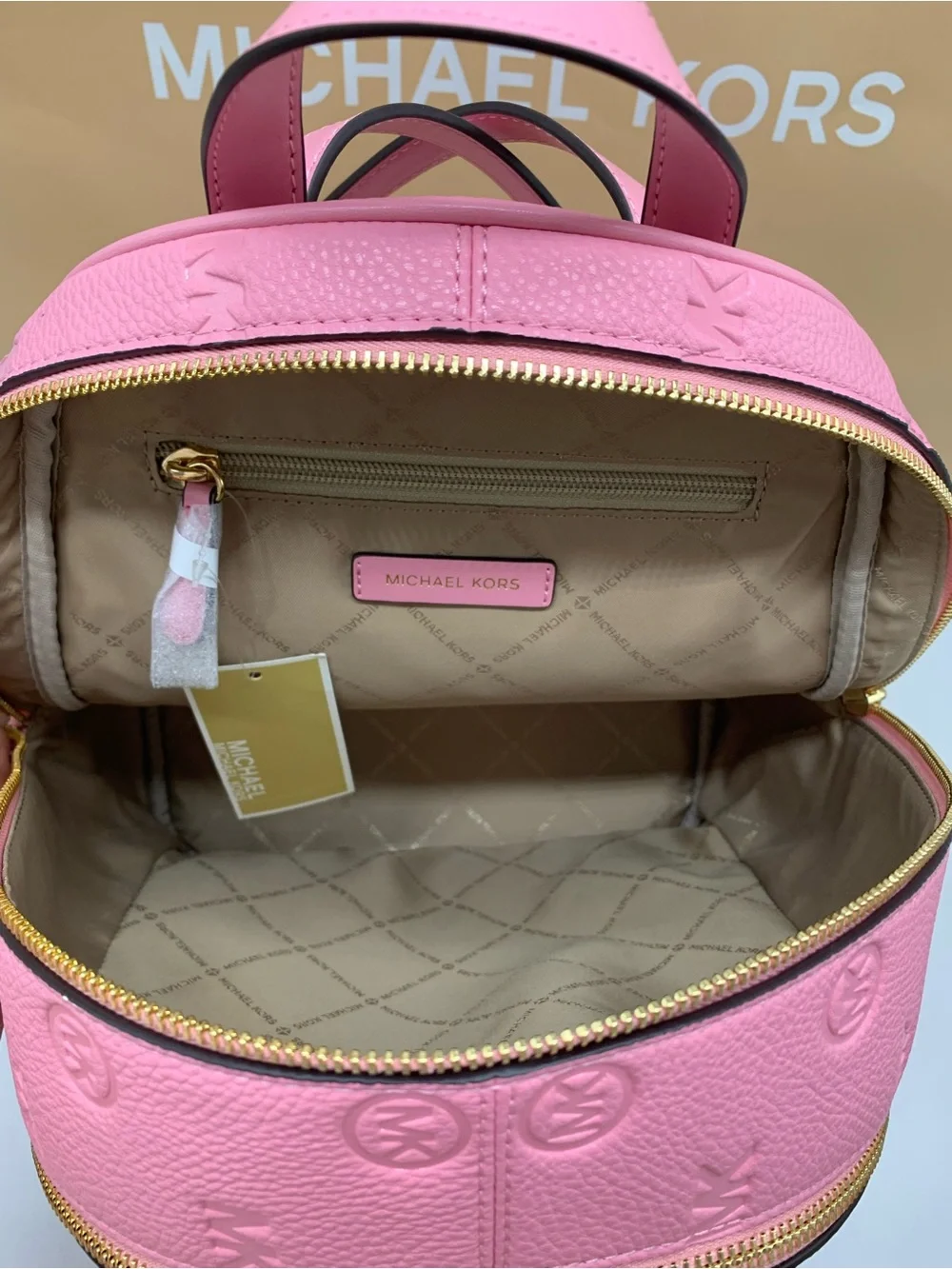 Michael Kors Rhea Carnation color Embossed MK Logo Backpack with Gold Hardware